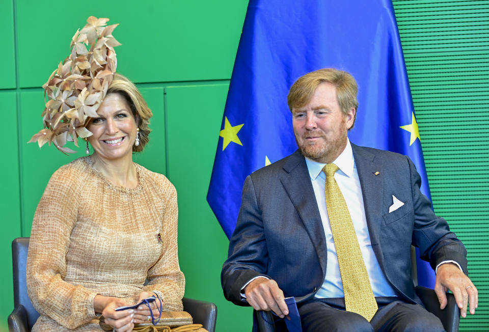 King Willem-Alexander and Queen Maxima of the Netherlands smile as they are welcomed by welcomed by the President of the Bundestag (lower house of parliament) Wolfgang Schaeuble at the parliament in Berlin, Germany, July 6, 2021. The Dutch royal couple is on a state visit to Germany until July 7, 2021. (Tobias Schwarz/AP via Pool)