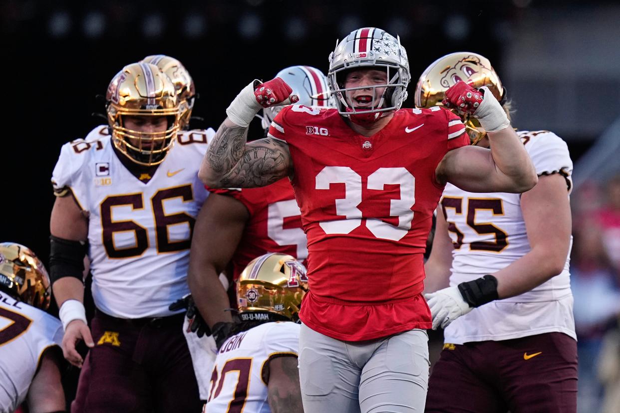 Nov 18, 2023; Columbus, Ohio, USA; Ohio State Buckeyes defensive end Jack Sawyer (33) celebrates a tackle during the first half of the NCAA football game against the Minnesota Golden Gophers at Ohio Stadium.