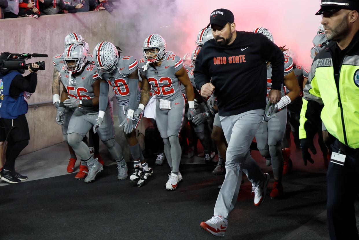 Ohio State coach Ryan Day leads the team onto the field for an NCAA college football game against Michigan State at Ohio Stadium in Columbus, Ohio, on Saturday, Nov. 11, 2023.
