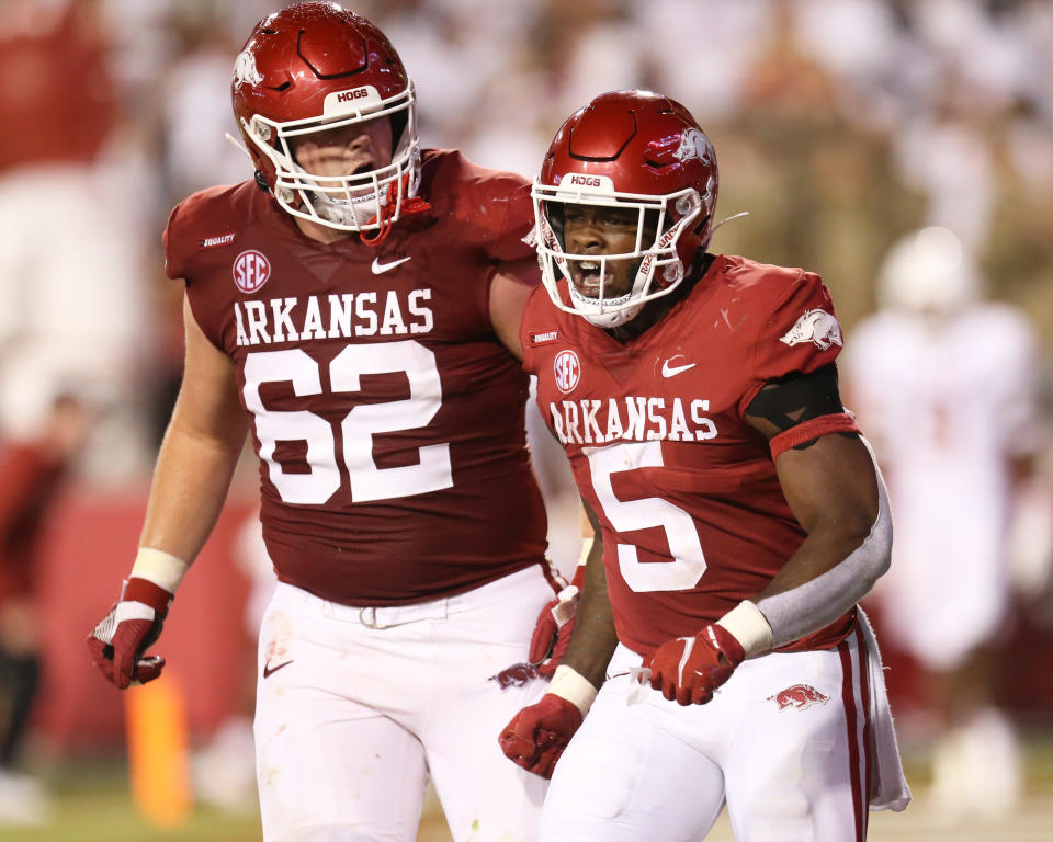 Sep 11, 2021; Fayetteville, Arkansas, USA; Arkansas Razorbacks offensive lineman Brady Latham (62) celebrates after a touchdown by running back <a class="link " href="https://sports.yahoo.com/ncaaf/players/322196" data-i13n="sec:content-canvas;subsec:anchor_text;elm:context_link" data-ylk="slk:Raheim Sanders;sec:content-canvas;subsec:anchor_text;elm:context_link;itc:0">Raheim Sanders</a> (5) against the <a class="link " href="https://sports.yahoo.com/ncaaf/teams/texas/" data-i13n="sec:content-canvas;subsec:anchor_text;elm:context_link" data-ylk="slk:Texas Longhorns;sec:content-canvas;subsec:anchor_text;elm:context_link;itc:0">Texas Longhorns</a> at Donald W. Reynolds Razorback Stadium. Arkansas won 40-21. Mandatory Credit: Nelson Chenault-USA TODAY Sports