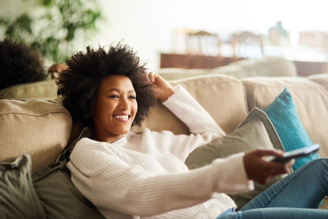 African American woman watching television