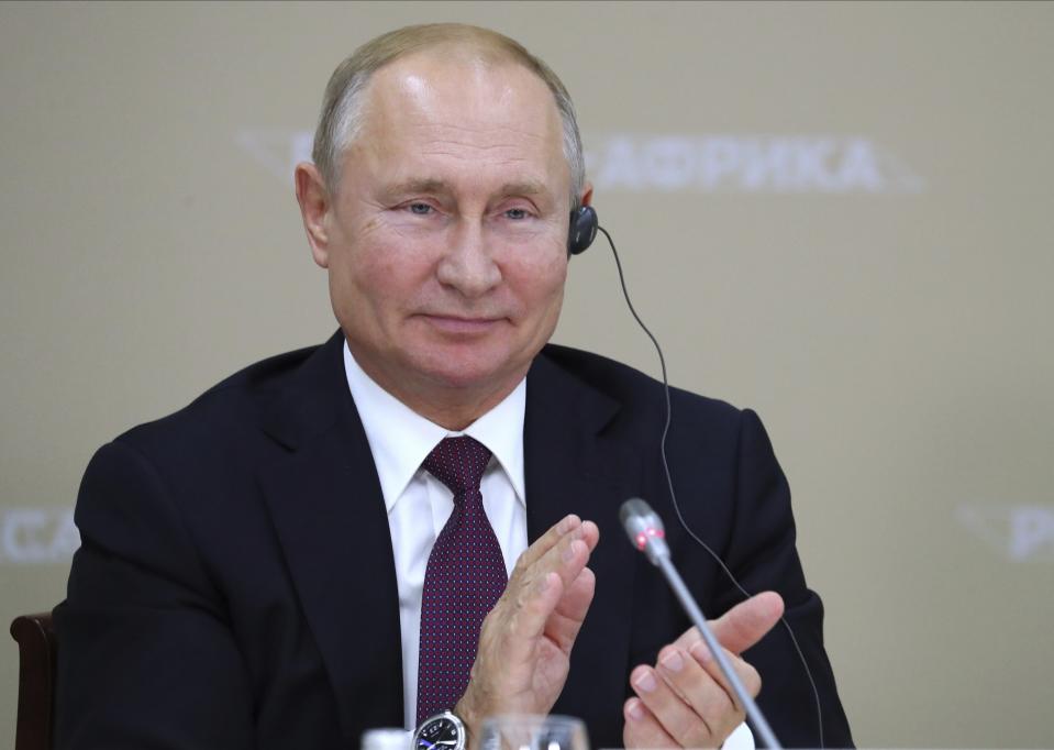 Russian President Vladimir Putin applauds during a luncheon with the heads of African regional organizations on the sideline of Russia-Africa summit in the Black Sea resort of Sochi, Russia, Wednesday, Oct. 23, 2019. (Donat Sorokin, TASS News Agency Pool Photo via AP)