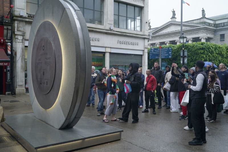 Fitted with a small camera, the pair of round screens have been broadcasting live street footage from one city to the other since May 8. Niall Carson/PA Wire/dpa