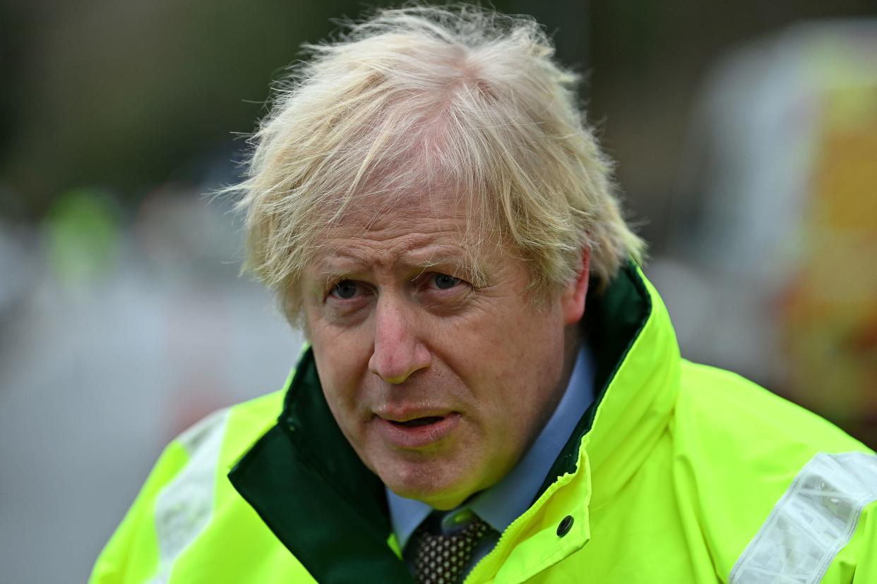 Prime Minister Boris Johnson on a visit to the North West to view flood defences (PA)