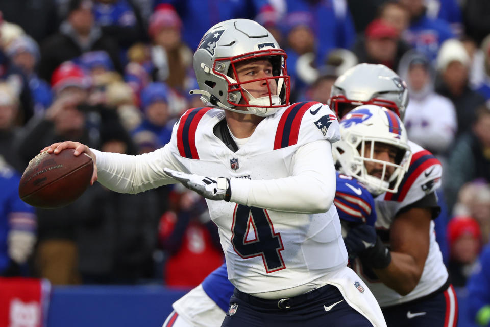 New England Patriots quarterback Bailey Zappe (4) throws a pass during the first half of an NFL football game against the Buffalo Bills in Orchard Park, N.Y., Sunday, Dec. 31, 2023. (AP Photo/Jeffrey T. Barnes )
