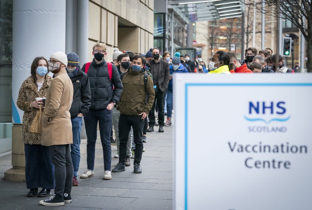 People queue at the Edinburgh International Conference Centre for vaccine boosters (Jane Barlow/PA) (PA Wire)