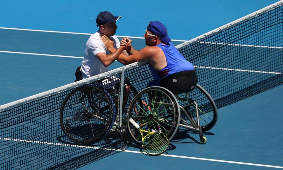 Dylan Alcott embraces his opponent and friend Andy Lapthorne at the net.