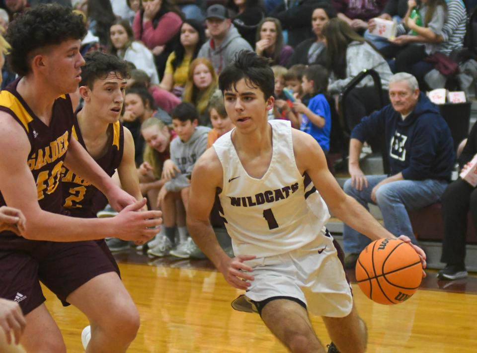 Sand Rock's Jacob St.Clair (right) attempts to drive by Spring Garden defender during a high school basketball game Friday, Jan. 14, 2022 in Sand Rock, Alabama.