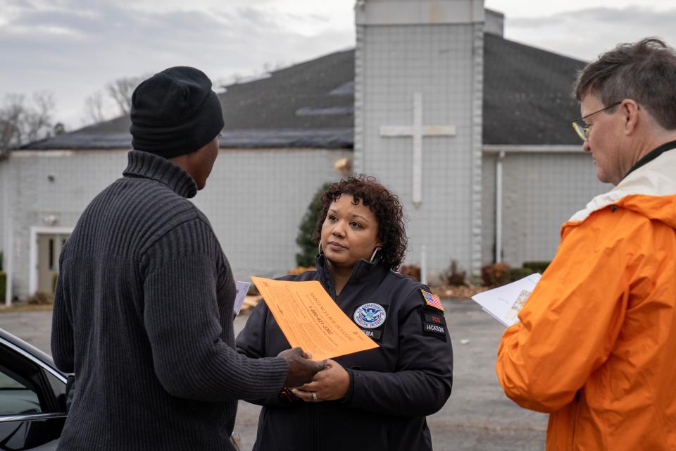 Clarksville, Tennessee (Dec 16, 2023) - FCO Yolanda Jackson speaks with Pastor Carl Livingston on Saturday, Dec. 16, 2023, in Clarksville, Tenn. Livingston’s community center for the church was destroyed after tornadoes swept through the neighborhood one week ago. FEMA photo by Madeleine Cook