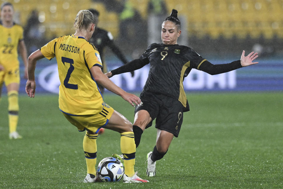 South Africa's Gabriela Salgado, right, and Sweden's Jonna Andersson compete for the ball during the Women's World Cup Group G soccer match between Sweden and South Africa in Wellington, New Zealand, Sunday, July 23, 2023. (AP Photo/Andrew Cornaga)