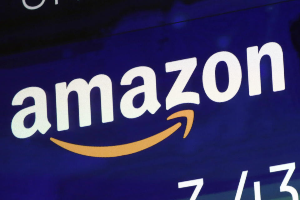 FILE - The Amazon logo is displayed on a screen at the Nasdaq MarketSite, July 27, 2018. With U.S. union ranks swelling as everyone from coffee shop baristas to warehouse workers seeks to organize, Illinois voters will decide in November 2022 whether to amend their state constitution to guarantee the right to bargain collectively. (AP Photo/Richard Drew, File)