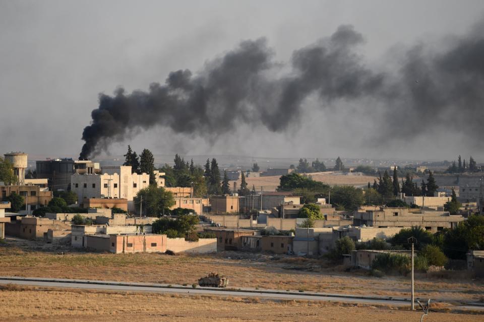 A Turkish army armored vehicle advances in Syrian city of Tel Abyad, as seen from the Turkish border town of Akcakale on October 13, 2019 in Akcakale, Turkey. The military action is part of a campaign to extend Turkish control of more of northern Syria, a large swath of which is currently held by Syrian Kurds, whom Turkey regards as a threat. U.S. President Donald Trump recently ordered the withdrawal of U.S. troops from several Syrian outposts near the Turkish border.