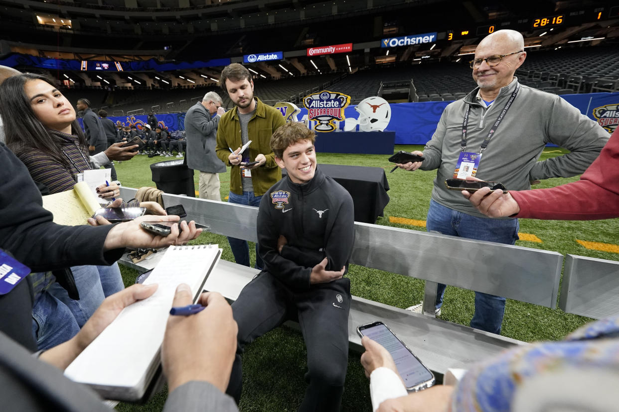 Texas quarterback Arch Manning talks to reporters during media day for the the upcoming Sugar Bowl NCAA college football semi-final game in New Orleans, Saturday, Dec. 30, 2023. (AP Photo/Gerald Herbert)