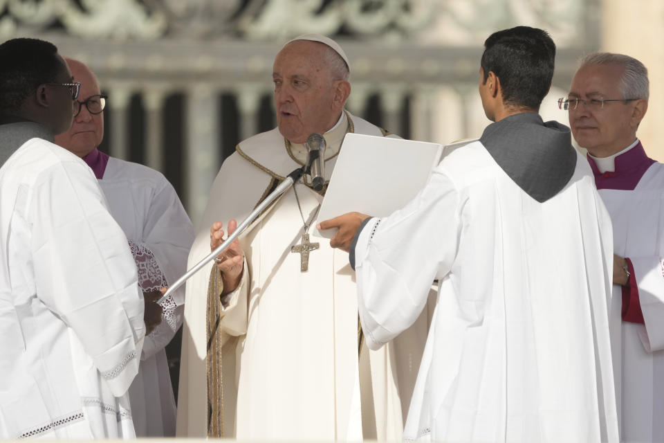 Pope Francis presides over a mass concelebrated by the new cardinals for the start of the XVI General Assembly of the Synod of Bishops in St. Peter's Square at The Vatican, Wednesday, Oct.4, 2023. Pope Francis is convening a global gathering of bishops and laypeople to discuss the future of the Catholic Church, including some hot-button issues that have previously been considered off the table for discussion. Key agenda items include women's role in the church, welcoming LGBTQ+ Catholics, and how bishops exercise authority. For the first time, women and laypeople can vote on specific proposals alongside bishops (AP Photo/Andrew Medichini)