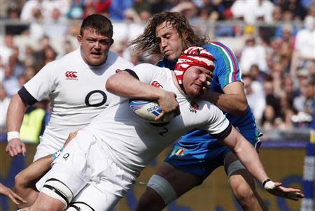 England's Ben Morgan (L) is tackled by Italy's Joshua Furno during their Six Nations rugby union match at Olympic Stadium in Rome, March 15, 2014. REUTERS/Tony Gentile