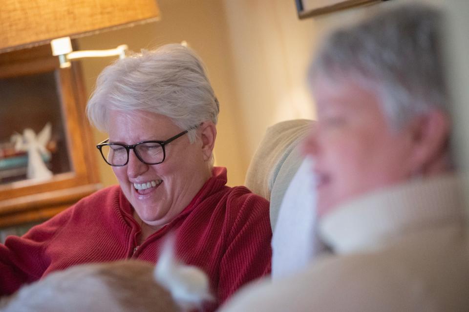 LGBTQ+ advocates the Rev. Susan Hrostowskileft, and her wife, Kathy Garner, speak in their Hattiesburg home about their life together, their legal battles, and why they have chosen to stay in Mississippi, Thursday, Nov. 29, 2023. Because of their fight against a Mississippi law banning same-sex couples from adopting, Hrostowski was able to adopt their son, Hudson Garner, 16 years old at that time. Their battle opened the doors for other same-sex couples to adopt.