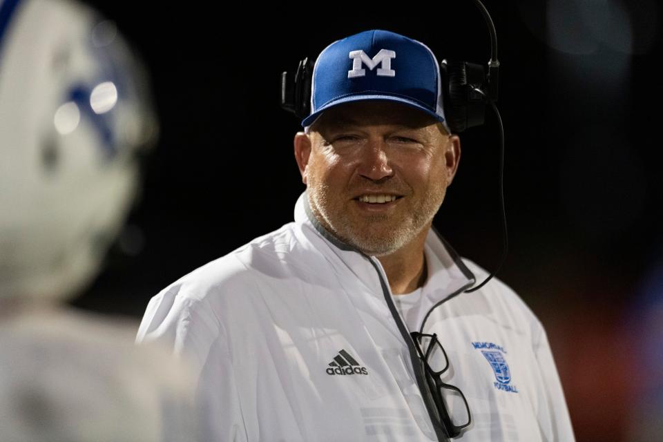 Memorial Head Coach John Hurley laughs on the sideline as the North Huskies play the Memorial Tigers at Bundrant Stadium Friday, Aug. 30, 2024.