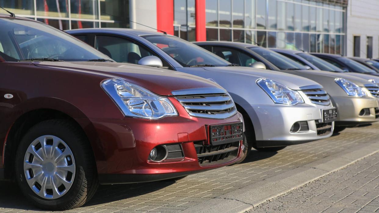 used car dealership with old car