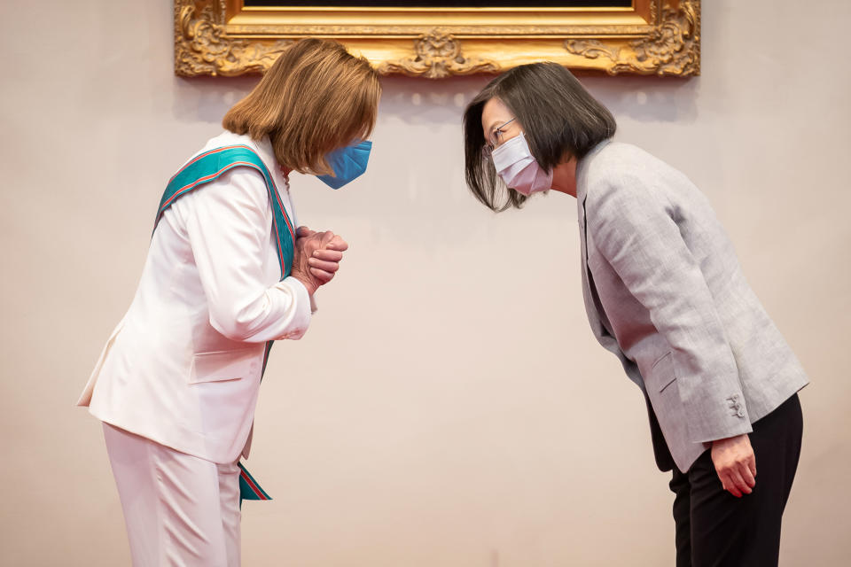 TAIPEI, TAIWAN - AUGUST 03: Speaker of the U.S. House Of Representatives Nancy Pelosi (D-CA), left, receives the Order of Propitious Clouds with Special Grand Cordon, Taiwan’s highest civilian honour, from Taiwan's President Tsai Ing-wen, right, at the president's office on August 03, 2022 in Taipei, Taiwan. Pelosi arrived in Taiwan on Tuesday as part of a tour of Asia aimed at reassuring allies in the region, as China made it clear that her visit to Taiwan would be seen in a negative light. (Photo by Handout/Getty Images)