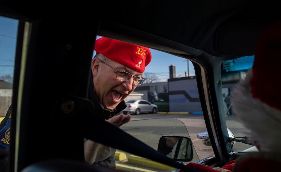 Matt Werling, the president of the Lincoln Park Goodfellows, smiles after talking with a Secret Santa elf in Lincoln Park on Thursday, Dec. 14, 2023.