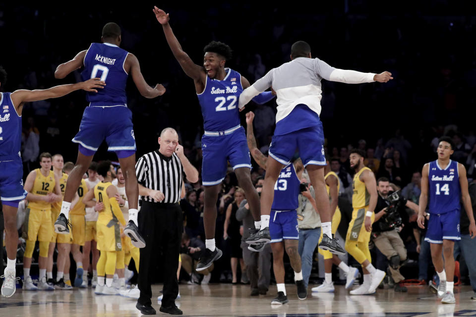 Seton Hall guard Quincy McKnight (0) and guard Myles Cale (22) celebrate after defeating Marquette during an NCAA college basketball semifinal game in the Big East men's tournament, early Saturday, March 16, 2019, in New York. Seton Hall won 81-79. (AP Photo/Julio Cortez)