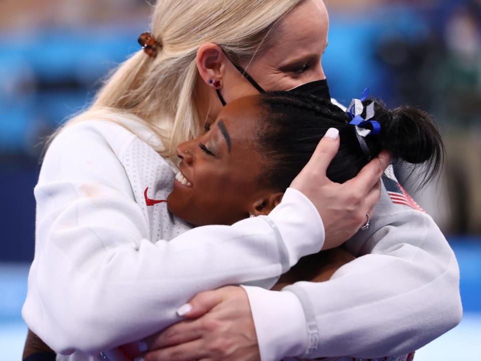 Simone Biles hugs her coach, Cecile Canqueteau-Landi.