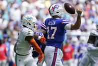 Miami Dolphins safety Jevon Holland (8) sacks Buffalo Bills quarterback Josh Allen (17) causing a fumble during the first half of an NFL football game, Sunday, Sept. 25, 2022, in Miami Gardens, Fla. (AP Photo/Wilfredo Lee )