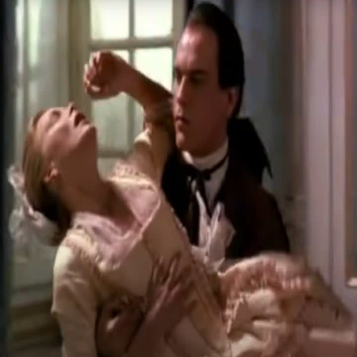 John Malkovich catching Michelle Pfeiffer, who is wearing a pink dress in Dangerous Liaisons