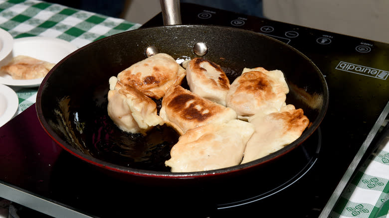 Pierogi being pan-fried 