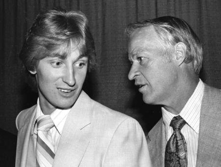 Former Edmonton Oiler Wayne Gretzky is shown talking with former Detroit Red Wings great Gordie Howe in Toronto at a reception for Howe the day after Howe retired from professional hockey June 5, 1980. REUTERS/Gary Hershorn