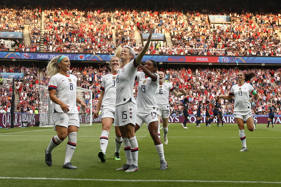 PARIS, FRANCE - JUNE 28:  Megan Rapinoe of the USA celebrates with teammates after scoring her team's first goal during the 2019 FIFA Women's World Cup France Quarter Final match between France and USA at Parc des Princes on June 28, 2019 in Paris, France. (Photo by Joosep Martinson - FIFA/FIFA via Getty Images)