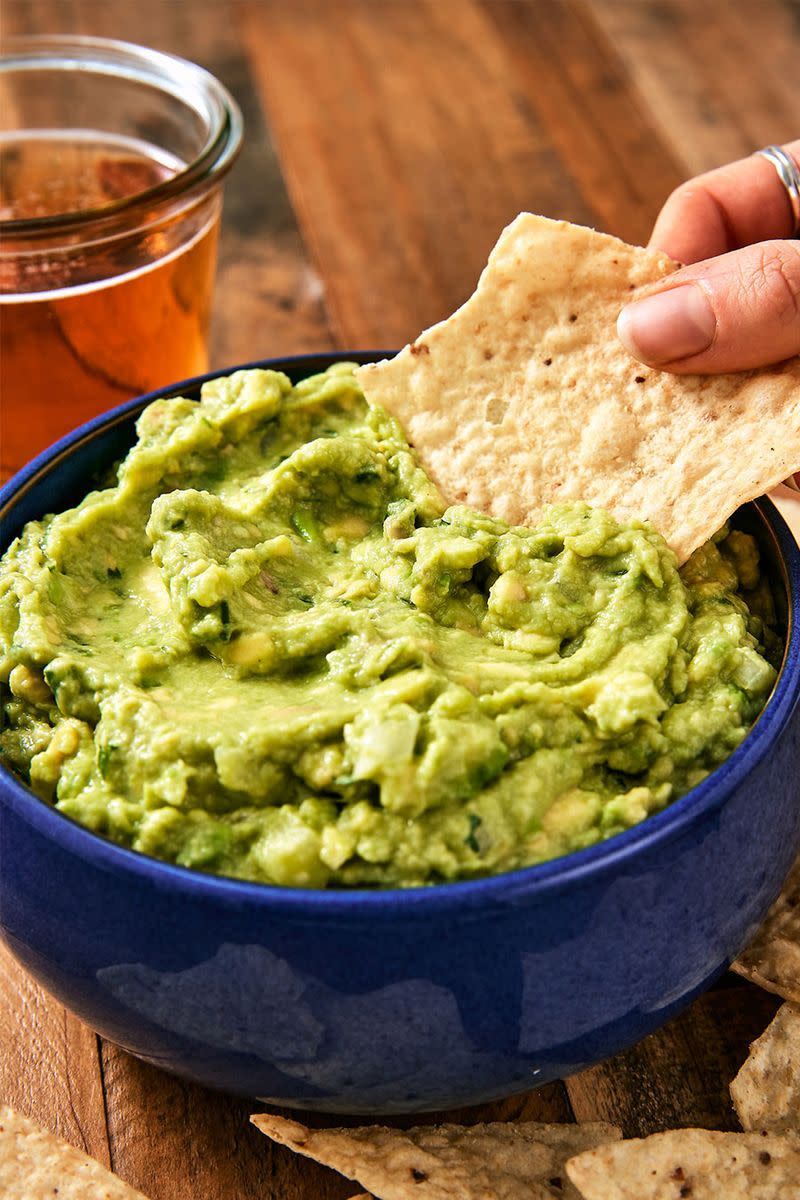 <p>Everyone has opinions about guac. Some, like us, like it simple. We prefer to let the flavour of our avo's shine. Others like to go crazy on the mix-ins: spices, tomatoes, garlic, etc. If that's your thing, this guacamole is the perfect jumping off point. Add whatever you like!</p><p>Get the <a href="https://www.delish.com/uk/cooking/recipes/a29947768/best-ever-guacamole-recipe/" rel="nofollow noopener" target="_blank" data-ylk="slk:Guacamole;elm:context_link;itc:0;sec:content-canvas" class="link ">Guacamole</a> recipe.</p>