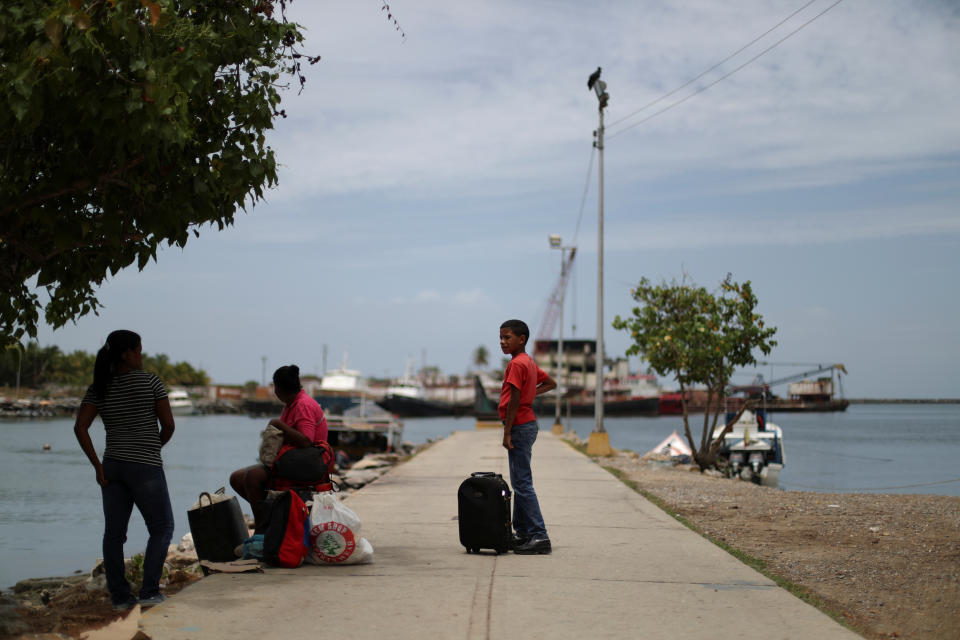 Local residents at a dock at Guiria, Venezuela, on May 23. (Photo: Ivan Alvarado/Reuters)