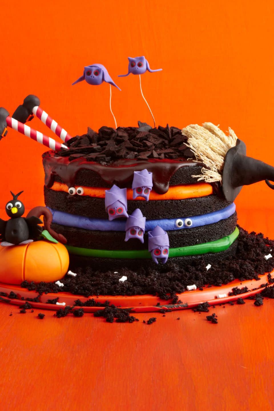 <p>Colorful buttercream and edible fondant creatures turn a basic chocolate cake into something spooky and special.</p><p>Get the <strong><a href="https://www.womansday.com/food-recipes/food-drinks/recipes/a51843/black-chocolate-cake/" rel="nofollow noopener" target="_blank" data-ylk="slk:Black Chocolate Witch Cake recipe;elm:context_link;itc:0;sec:content-canvas" class="link ">Black Chocolate Witch Cake recipe</a></strong>.</p>