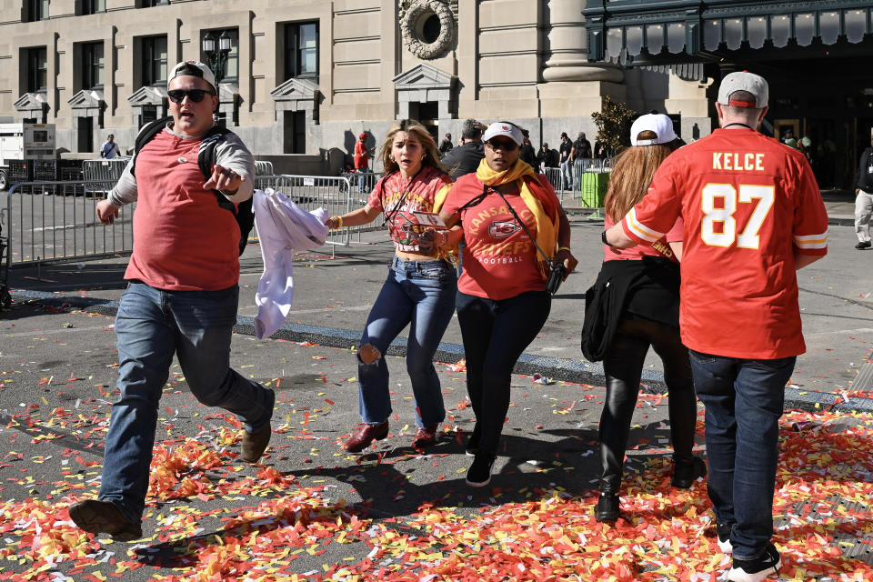 People flee after shots were fired near the Kansas City Chiefs' Super Bowl LVIII victory parade on Wednesday in Kansas City, Missouri.