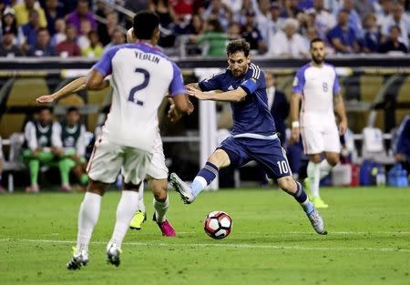 Jun 21, 2016; Houston, TX, USA; Argentina midfielder Lionel Messi (10) kicks the ball as United States defender DeAndre Yedlin (2) defends during the second half in the semifinals of the 2016 Copa America Centenario soccer tournament at NRG Stadium. Kevin Jairaj-USA TODAY Sports