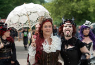 <p>Participants in fancy costumes attend the Wave Gothic Festival (WGT) in Leipzig, Germany, Saturday, June 3, 2017. (AP Photo/Jens Meyer) </p>