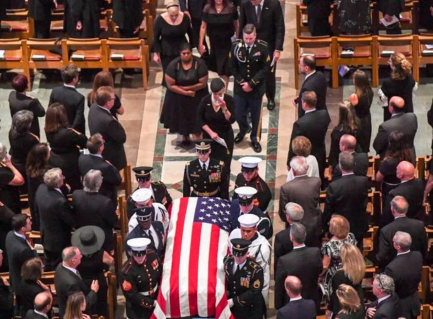 FILE - Cindy McCain follows the casket out of the funeral service for her late husband Sen. John McCain at the National Cathedral in 2018. Trump used his new &#x00201c;Letters to Trump&#x00201d; book to slam the late senator.