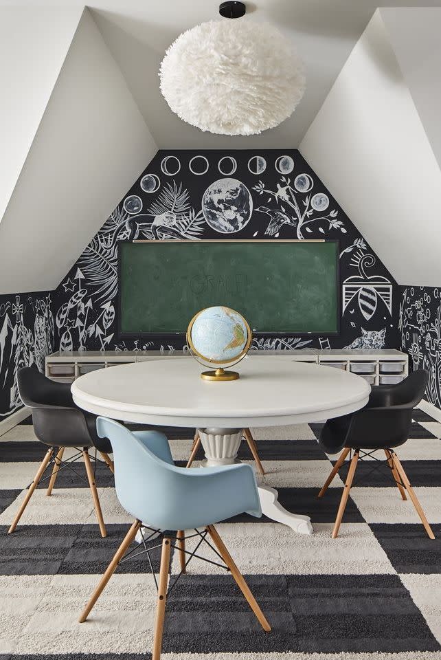 <p>With a study area this chic, your kids won't have any issues tackling their homework assignments. This striking design scheme, featuring black-and-white carpeting and a chalkboard accent wall, is guaranteed to help maintain their focus and let their imagination run wild. </p>