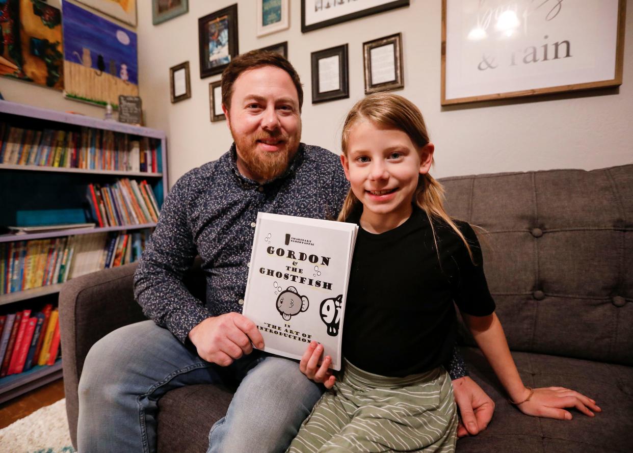 Linkyn Rippee, 8, and her father and Zachariah wrote and illustrated a children's book called "Gordon and the Ghostfish" on snow days.