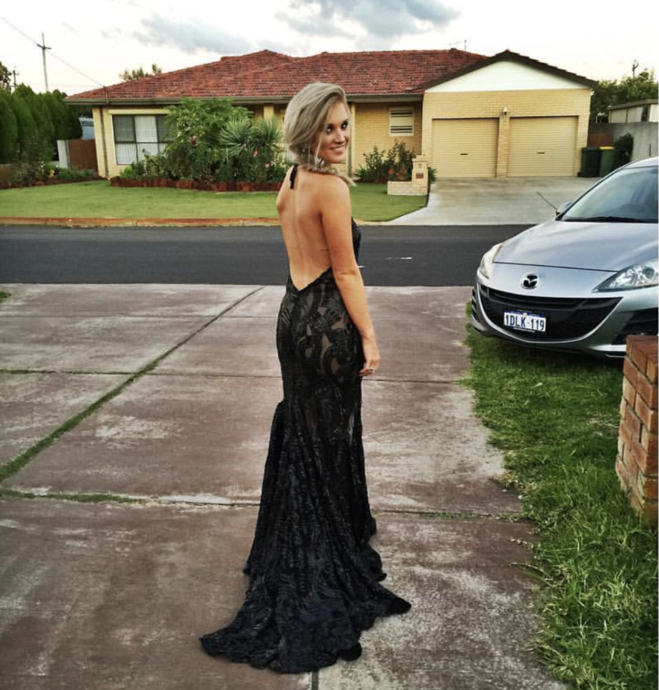 A photos shows Kayla Halnan in a black formal dress.