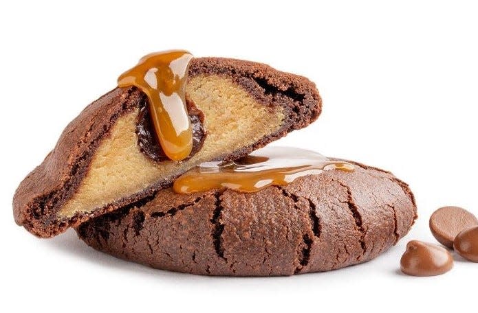 The Brookie, a combination brownie and chocolate chip cookie filled and drizzled with caramel sauce, is among the popular classic gourmet cookies offered at Dirty Dough, a newly opened gourmet dessert shop in The Pavilion at Durbin Park in Saint Johns.