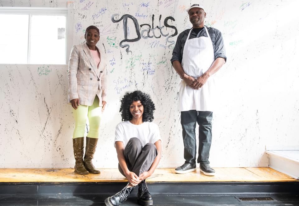 (From left) Tania Jackson, Tamber Jackson and Steve Jackson pose for a portrait in front of a wall filled with customers' signatures at their new restaurant, Datts Seafood, Wednesday, Jan. 12, 2022, in Hanover Borough. Although they just opened on New Year's Day, dozens of patrons have already signed the wall and left positive messages for the Jacksons.