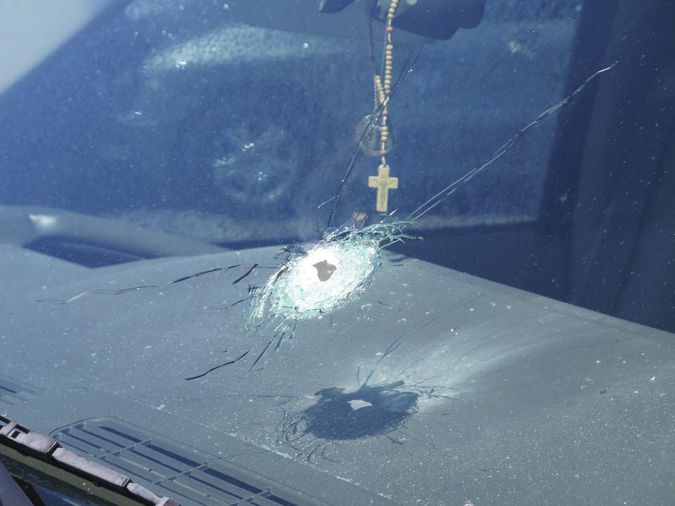 Handout photo of a bullet hole in a windshield of a car that was traveling on Interstate 10 in Phoenix