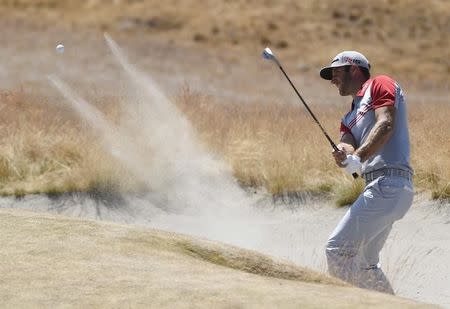 Jun 20, 2015; University Place, WA, USA; Dustin Johnson hits out of a bunker in the third round of the 2015 U.S. Open golf tournament at Chambers Bay. Mandatory Credit: Kyle Terada-USA TODAY Sports