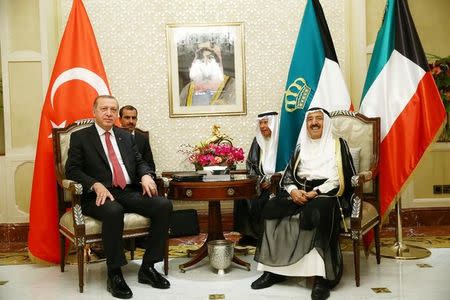 Turkish President Tayyip Erdogan meets with the Emir of Kuwait Sabah Al-Ahmad Al-Jaber Al-Sabah in Kuwait City, Kuwait, July 23, 2017. Kayhan Ozer/Presidential Palace (Turkey)/Handout via REUTERS
