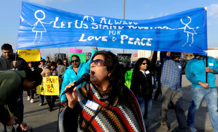 Hira Nair leads a chant during a march before a vigil for Srinivas Kuchibhotla, an Indian engineer who was shot and killed, at a conference center in Olathe, Kansas, U.S., February 26, 2017. REUTERS/Dave Kaup