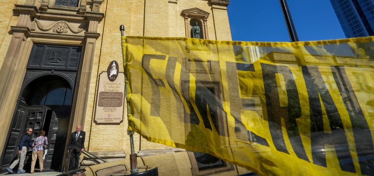 People enter the Cathedral of St. John the Evangelist Tuesday for the funeral of former Archbishop Rembert Weakland Tuesday. in downtown Milwaukee. Milwaukee Archdiocese officials did not allow news reporters or cameras to enter the cathedral.