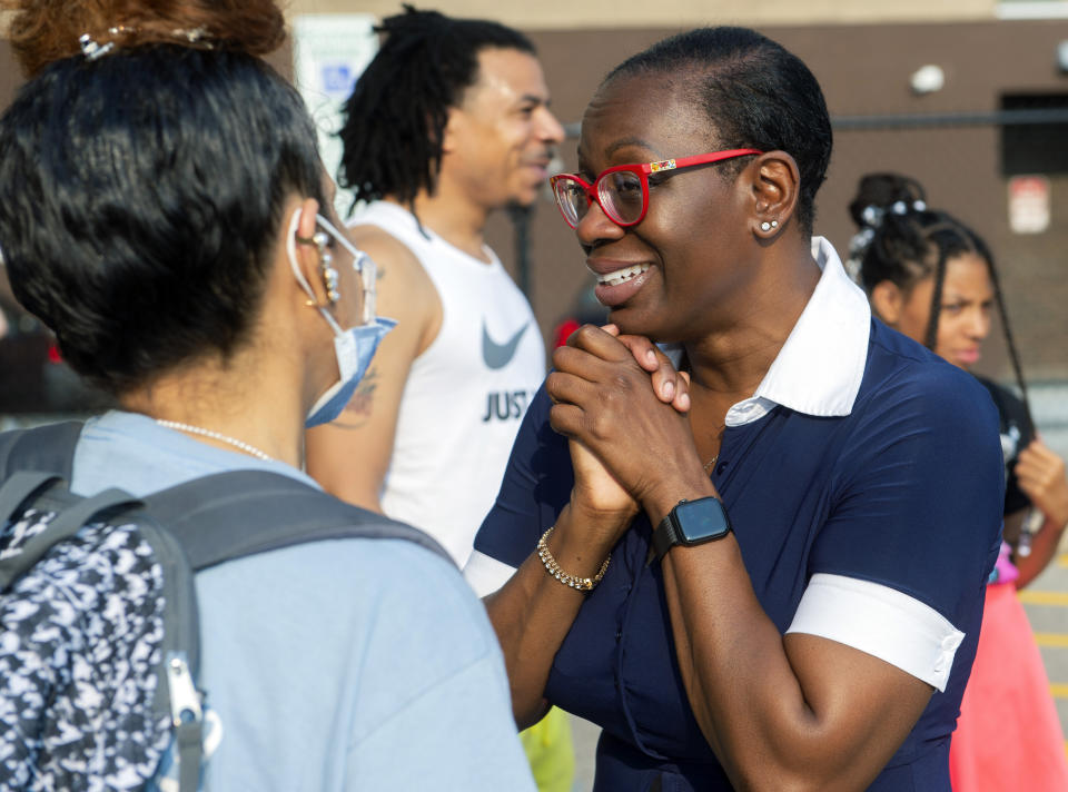 In this July 7, 2021, photo Nina Turner, a candidate running in a special Democratic primary election for Ohio's 11th Congressional District speaks with supporters at the Cuyahoga County Board of Elections after casting her vote in Cleveland. (AP Photo/Phil Long)