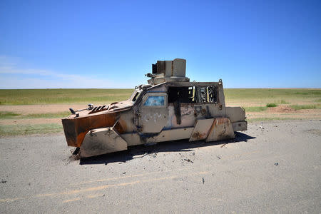 A vehicle that belonged to Islamic State militants is seen on the outskirts of the ancient city of Hatra near Mosul,Iraq April 26, 2017. REUTERS/Stringer